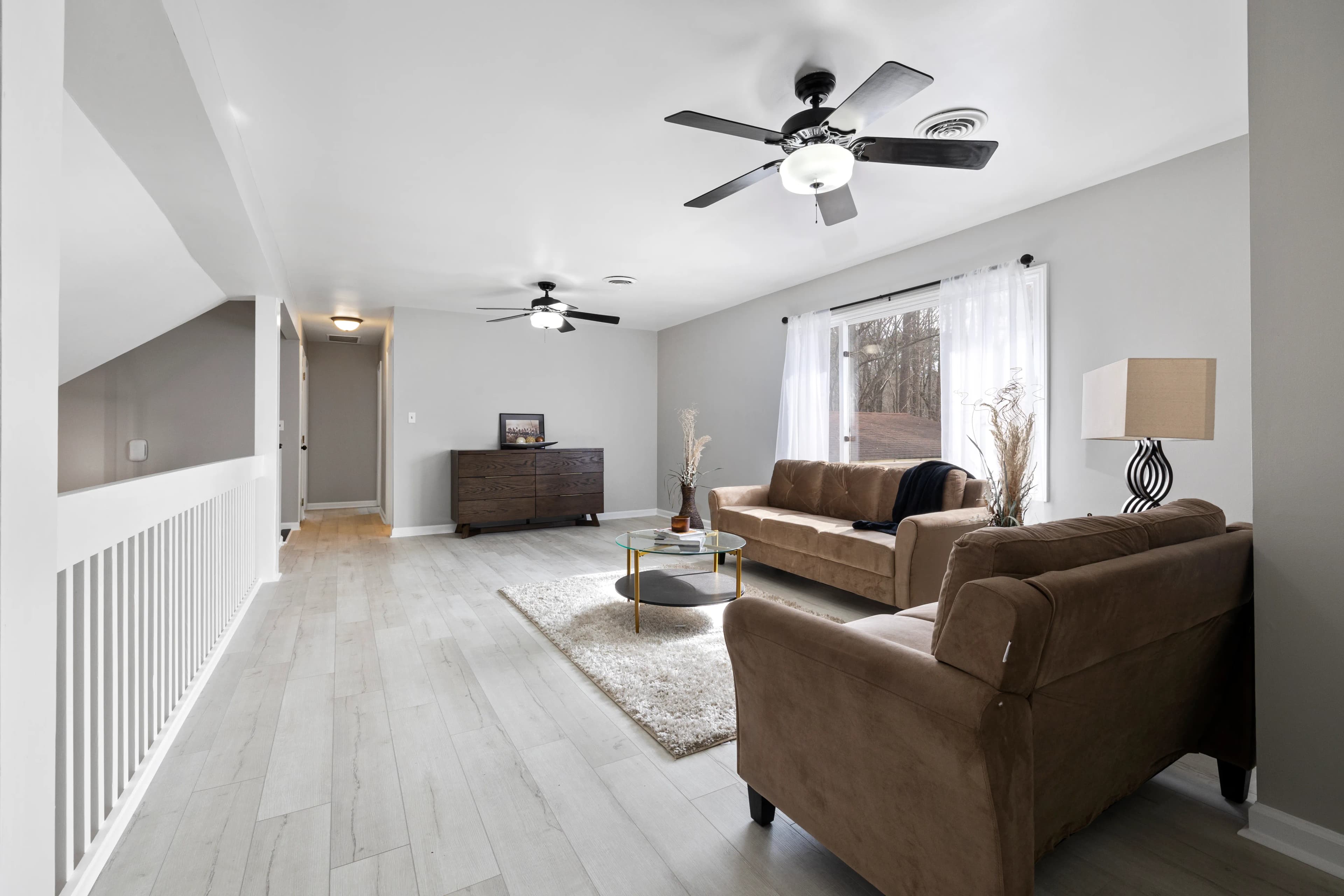Bright living room with light engineered oak floorboards