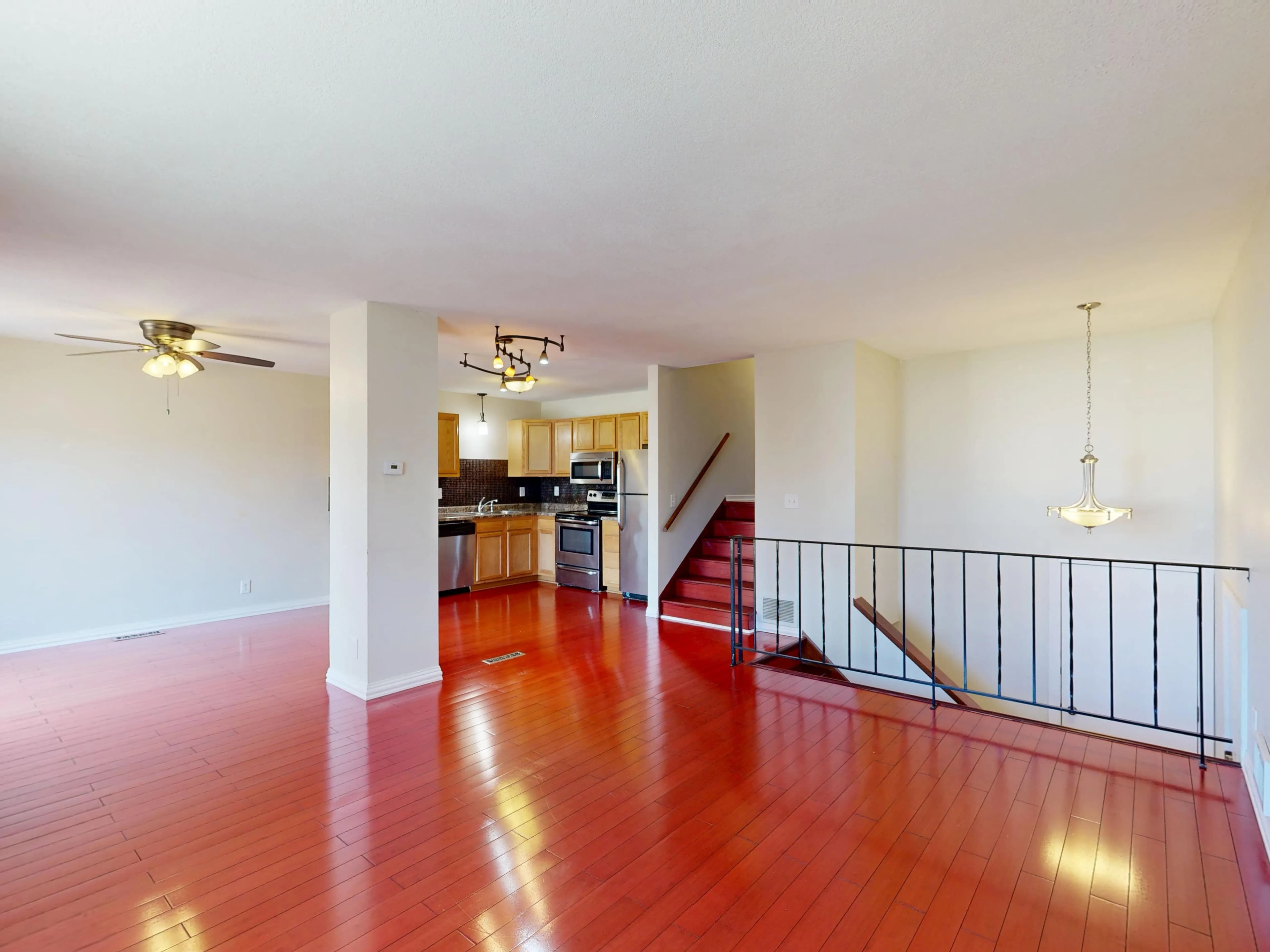 Open-plan kitchen and living area with timber-look floor